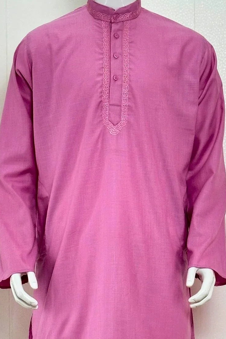 Pink kurta with white pants on a mannequin against a plain background