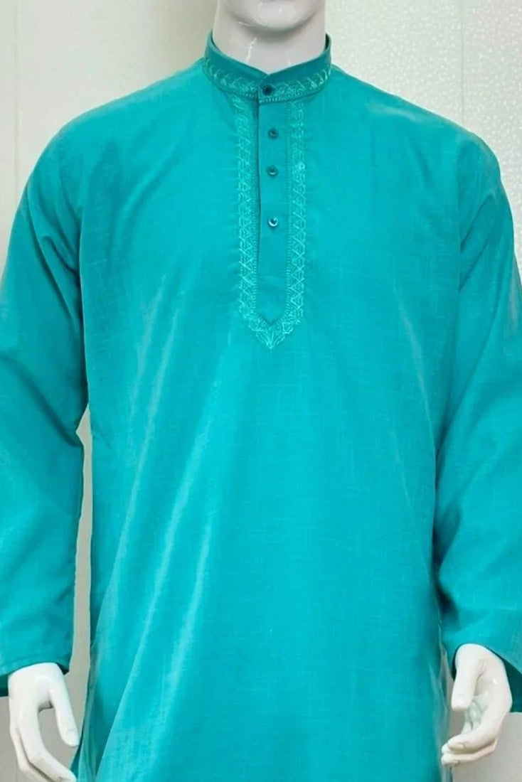 Teal kurta with white pants on a mannequin against a plain background