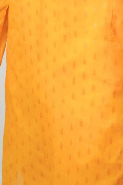 Man wearing an orange kurta against a white background